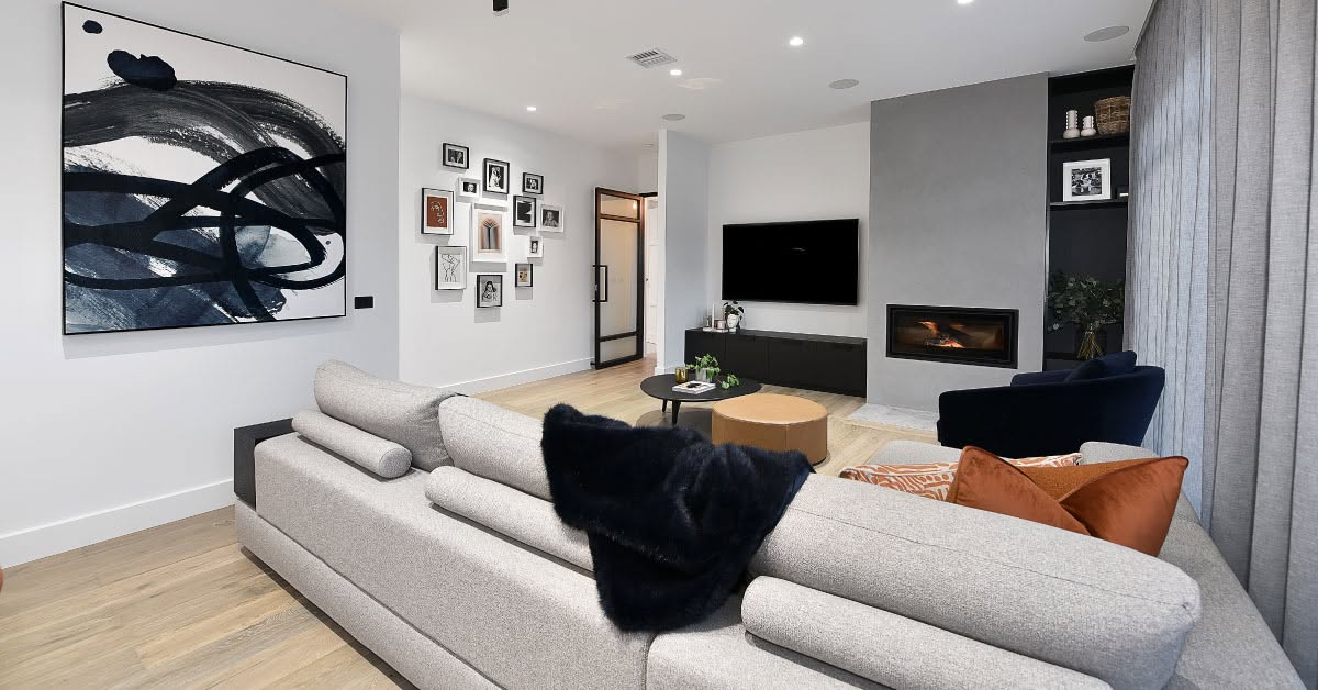 Polished Venetian plaster feature wall with built-in fireplace in modern Melbourne living room