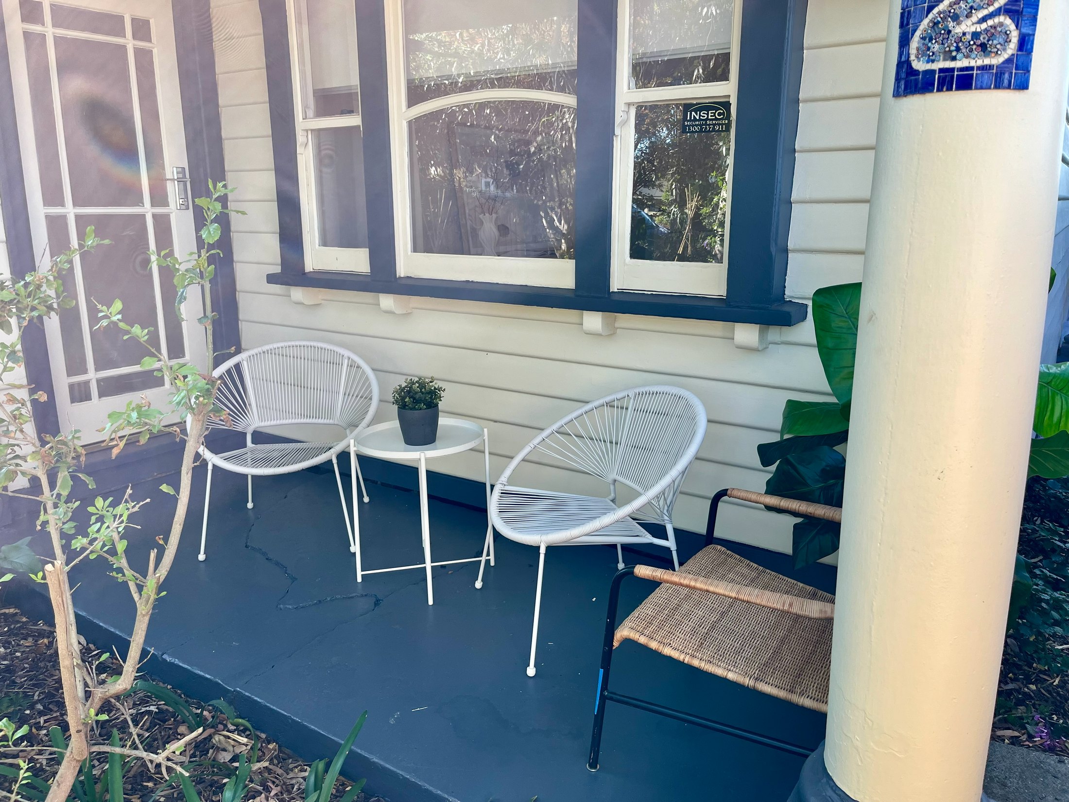 Newport front porch with freshly painted concrete floor, repainted weatherboards, window frames and column