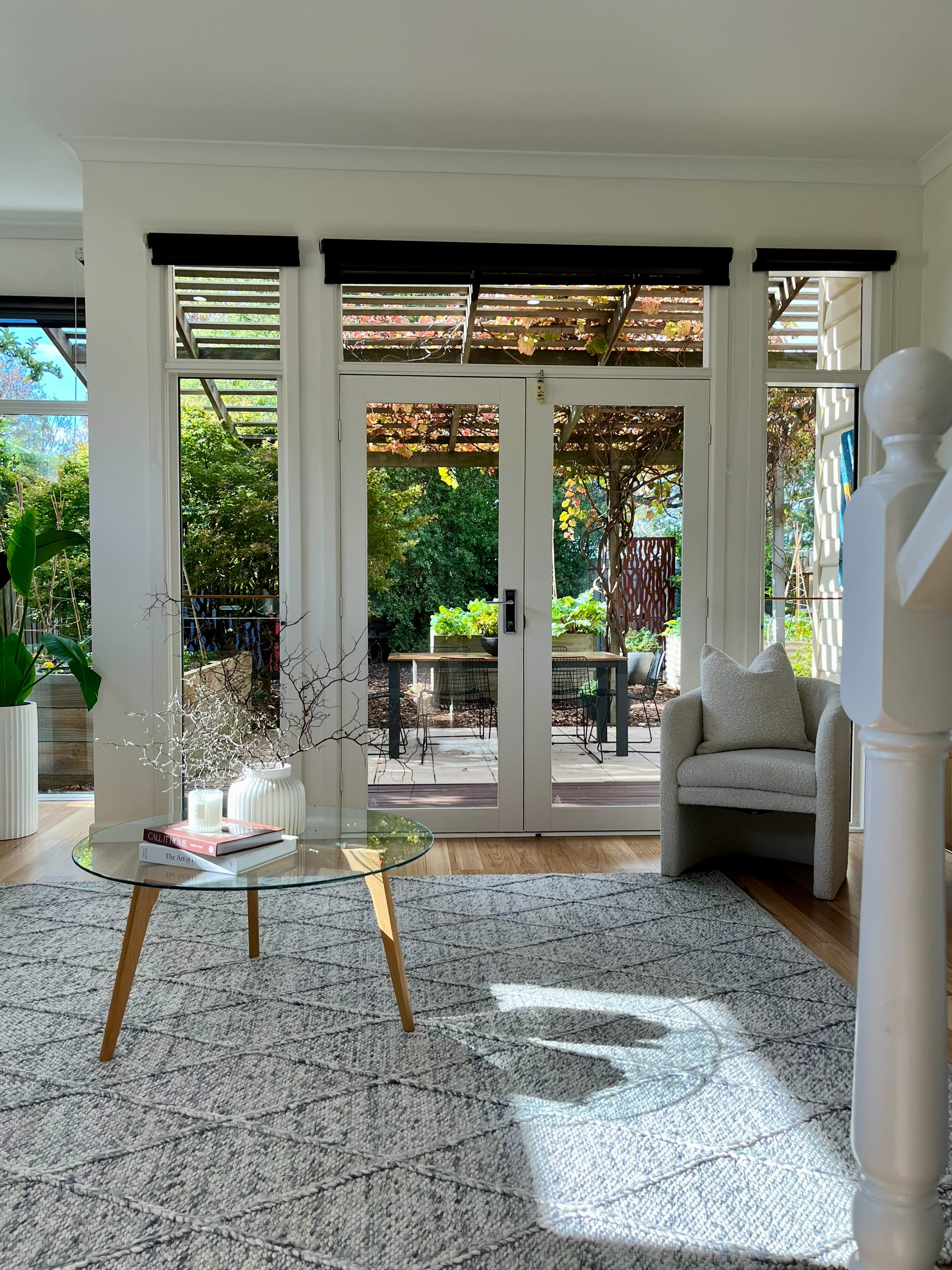 Completed lounge area of the Newport home looking out through repainted French doors to the garden