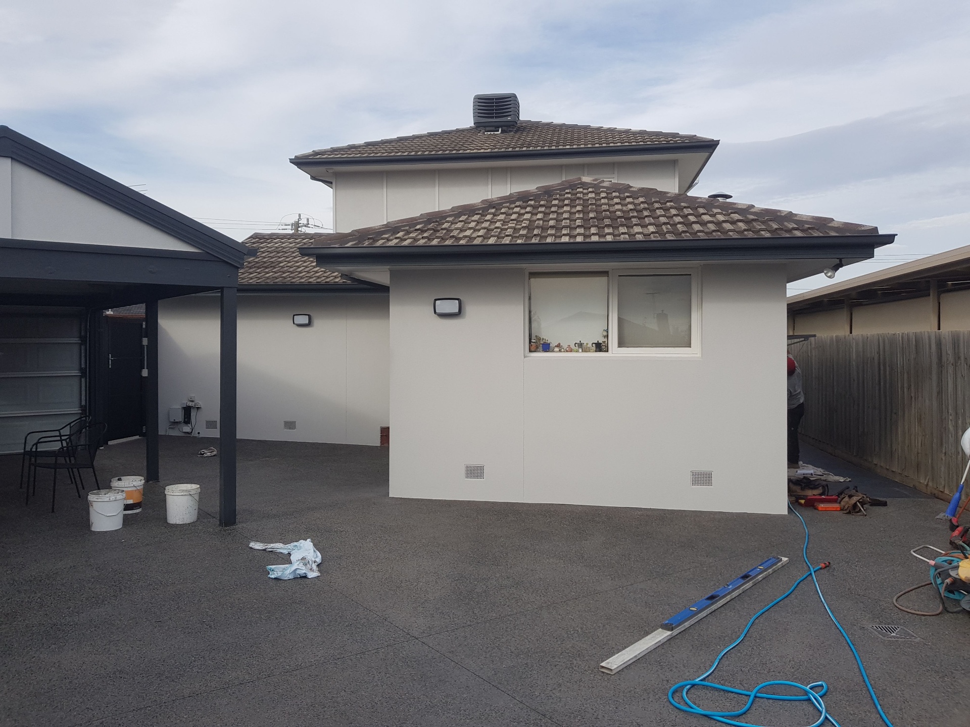 Freshly rendered rear extension and garage with smooth white acrylic finish, Melbourne VIC
