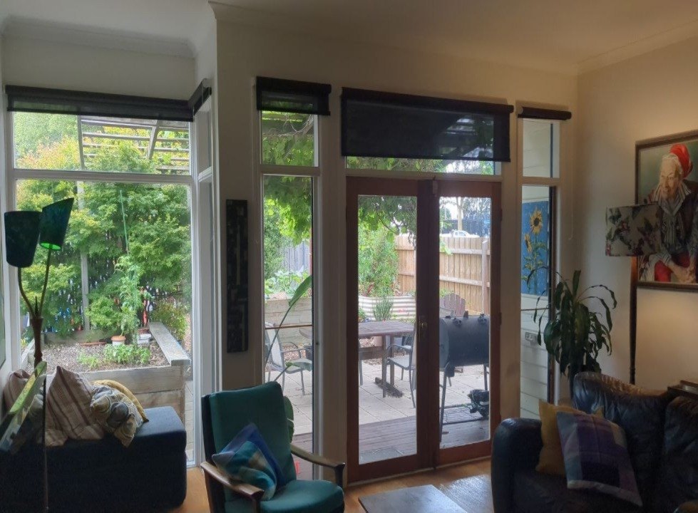 Living area of the Newport home before works, with the original timber French doors