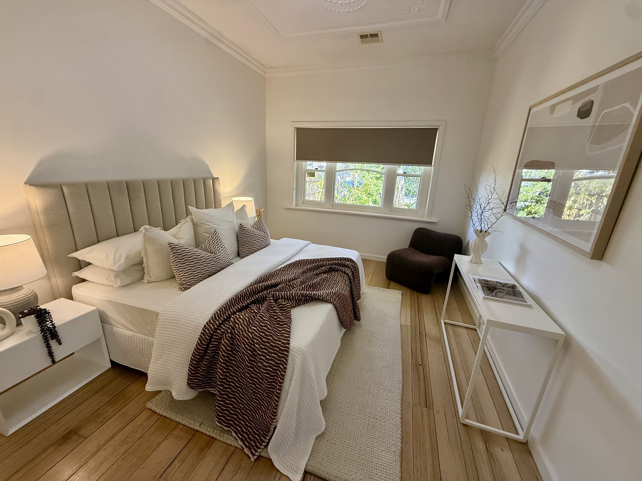 Completed bedroom in the restored Newport home with fresh paintwork and sealed timber floors
