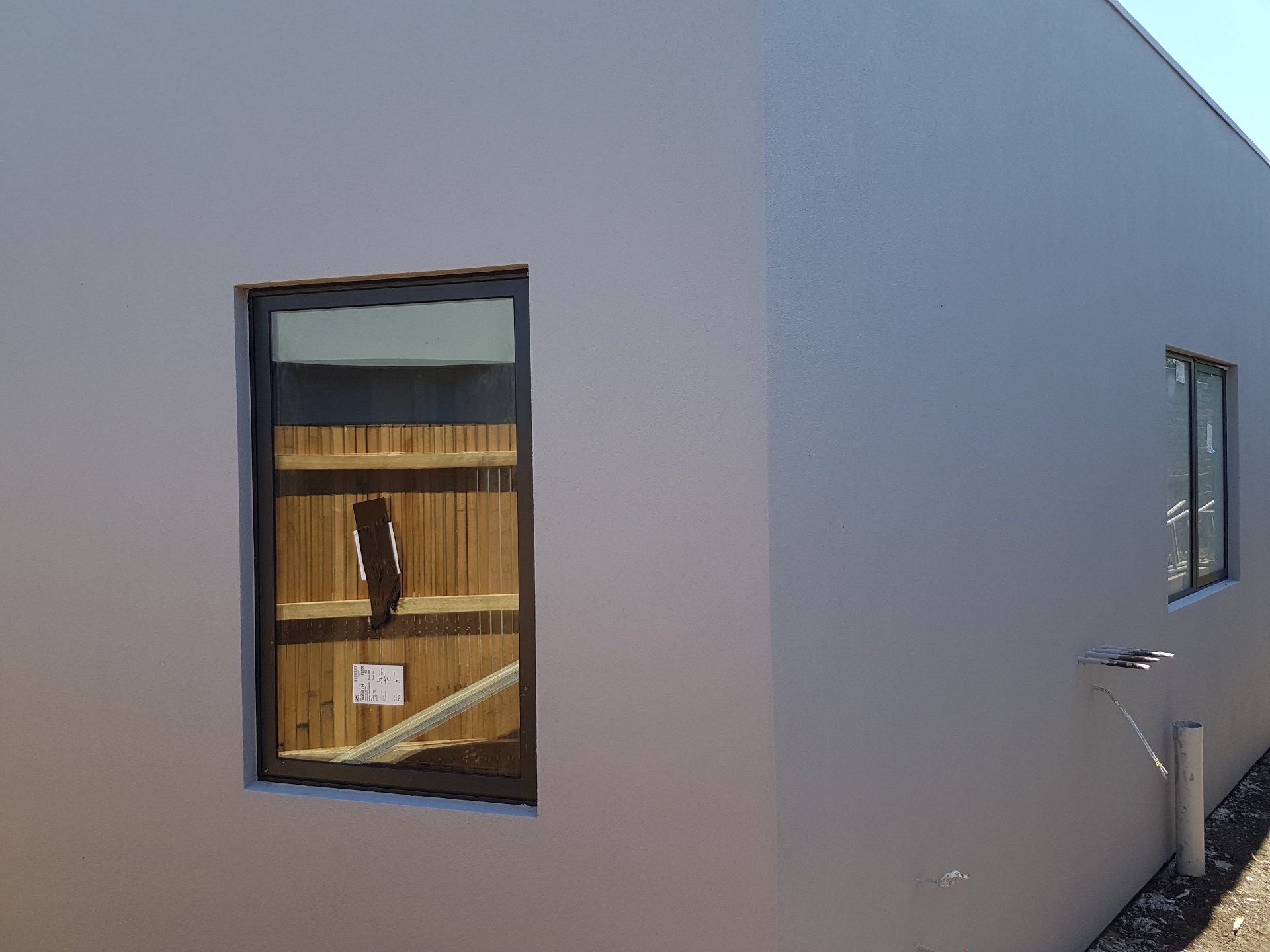 Smooth render corner detail with clean window reveal and even finish, Melbourne VIC