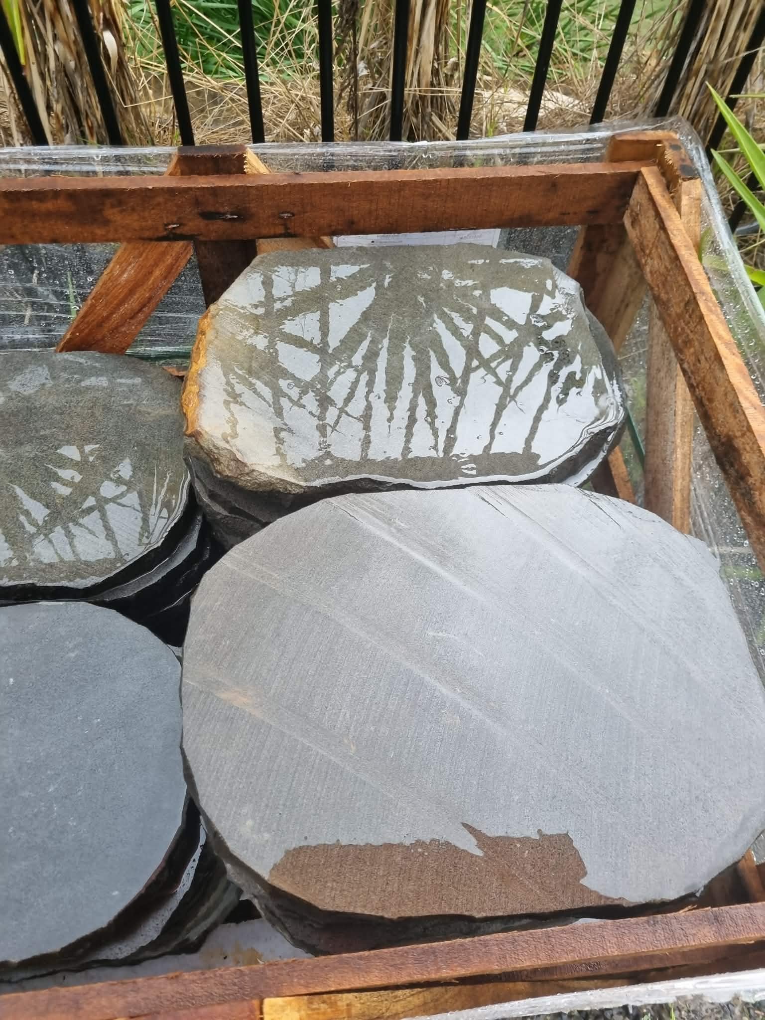 Bluestone stepper pavers delivered on site in a crate before installation at the Newport property