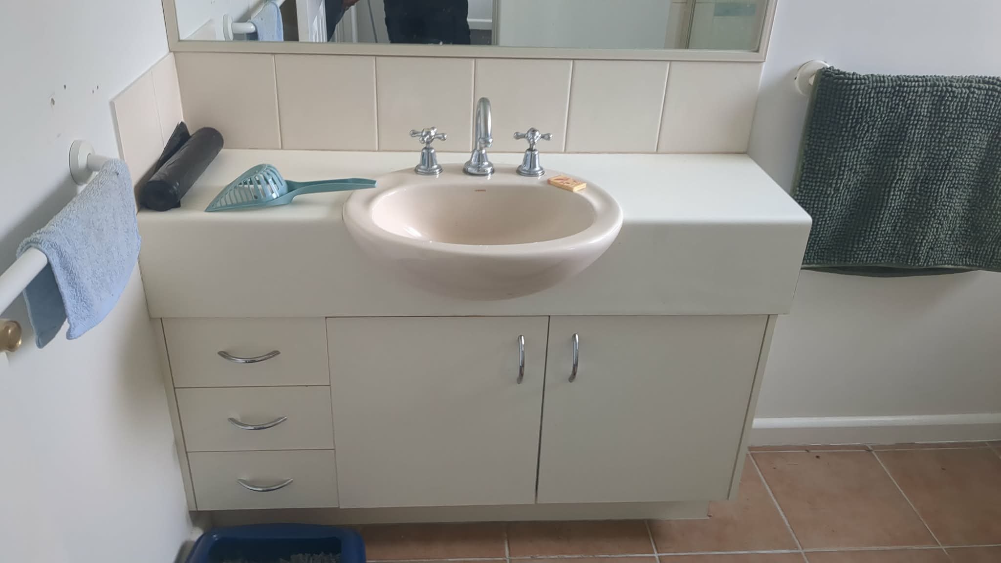Original dated bathroom vanity in the Newport home before replacement