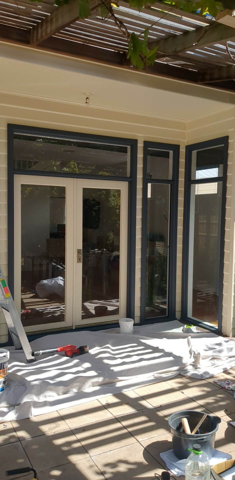 Rear of the Newport property with drop sheets down and windows masked while works were underway