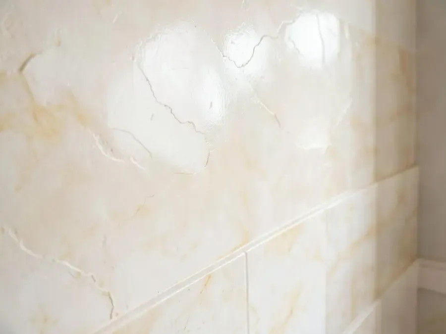 Close view of a polished Venetian plaster wall showing layered tonal movement and sheen