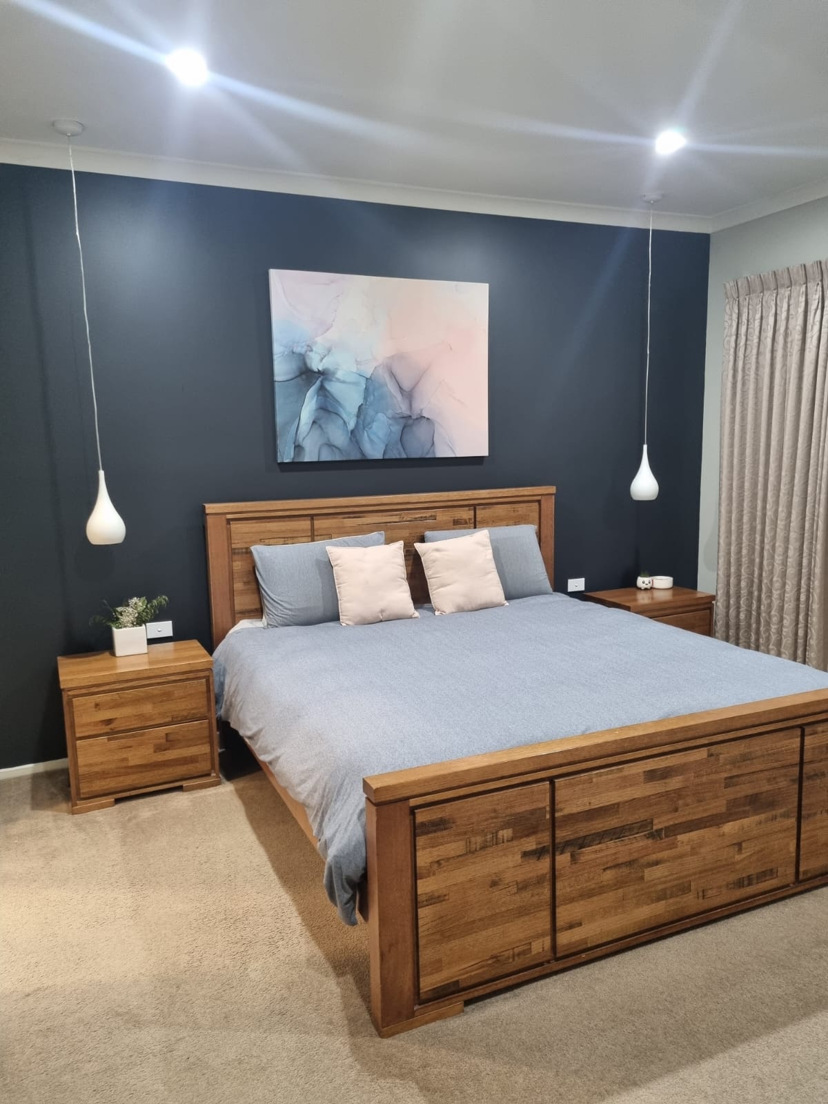 Bedroom feature wall painted in dark blue, Doreen Victoria