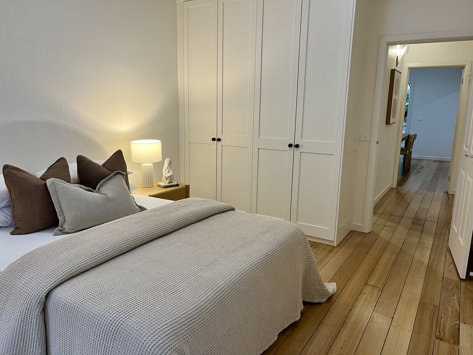 Master bedroom interior repaint with crisp white walls and built-in wardrobes at 2 Derkin Street, Newport VIC
