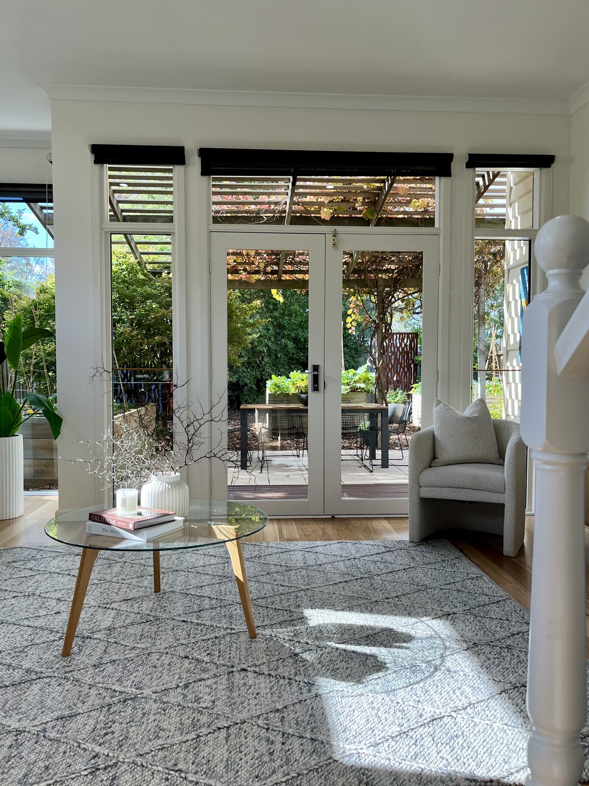Living room interior repaint with French doors and white trim detailing at 2 Derkin Street, Newport VIC