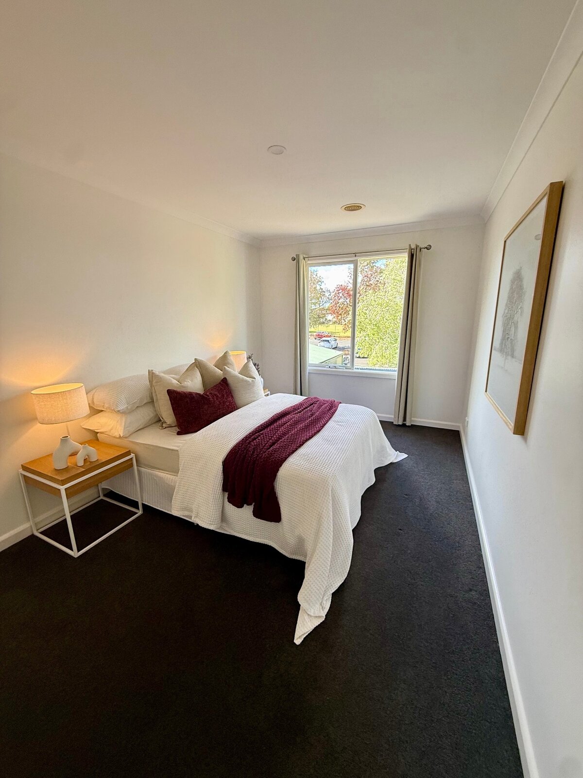Freshly painted bedroom with crisp white walls and warm interior styling at 2 Derkin Street, Newport VIC