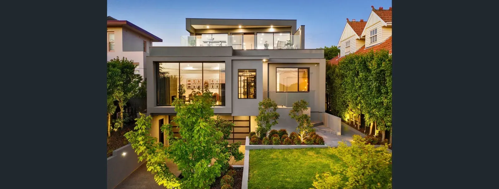 Melbourne home restored, repainted and re-rendered before sale — dusk facade with landscaped front garden